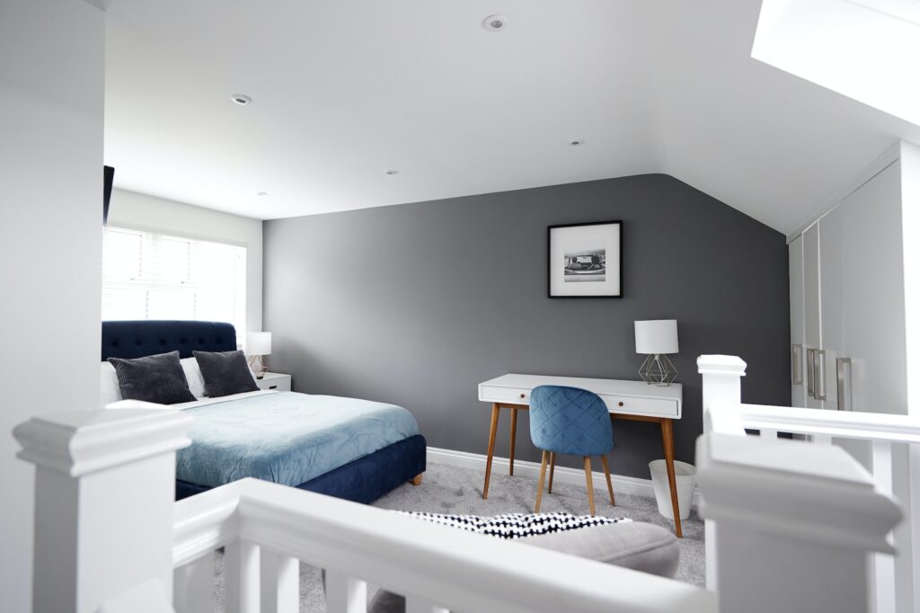 Interior of a house, loft conversion bedroom seen across stair banister