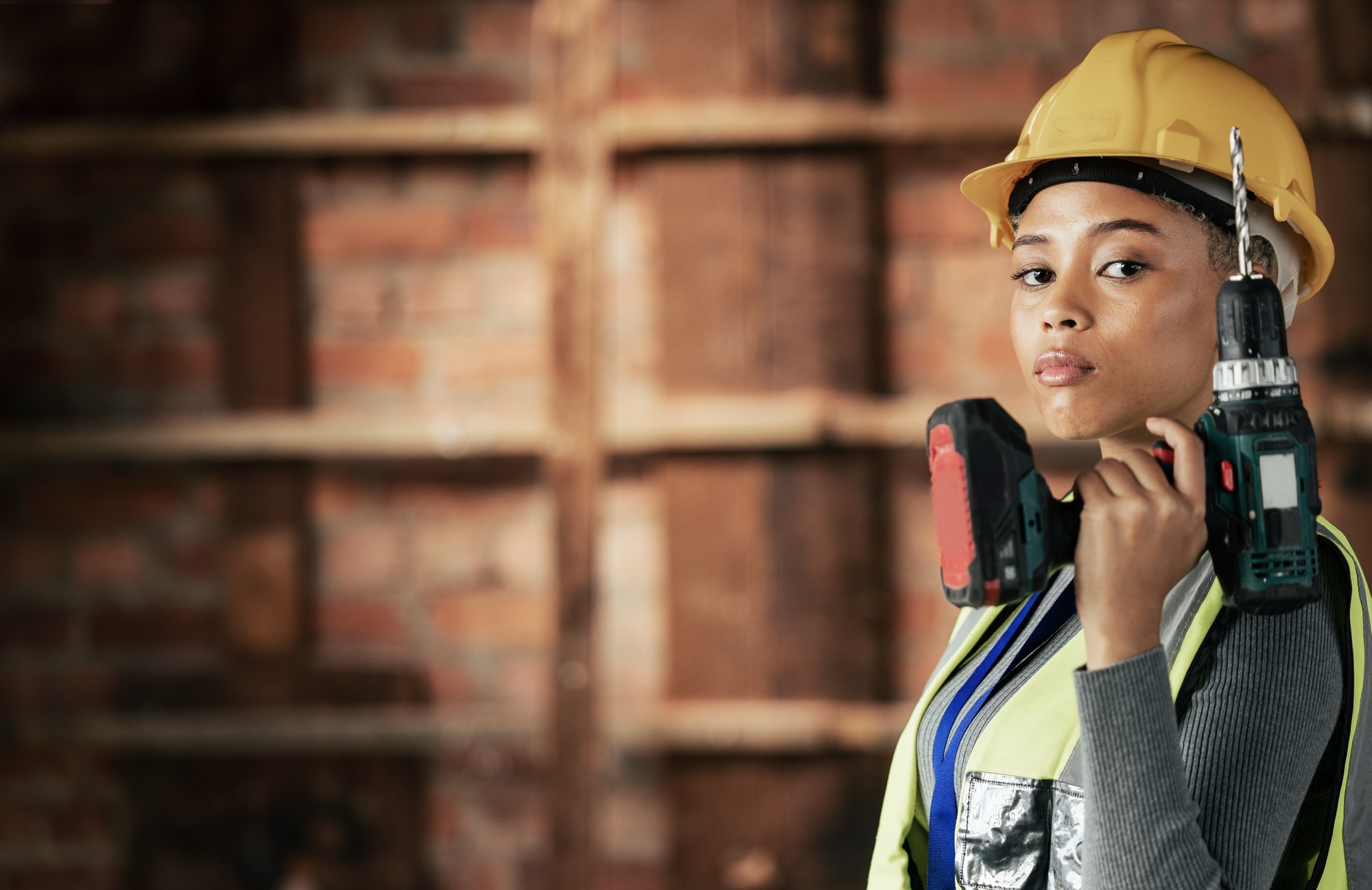Woman, construction worker or drill tool in property, house or home construction site or innovation